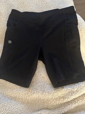 Athleta Black High-Rise Bike Shorts with Side Pocket. Size small 7’ inseam. EUC